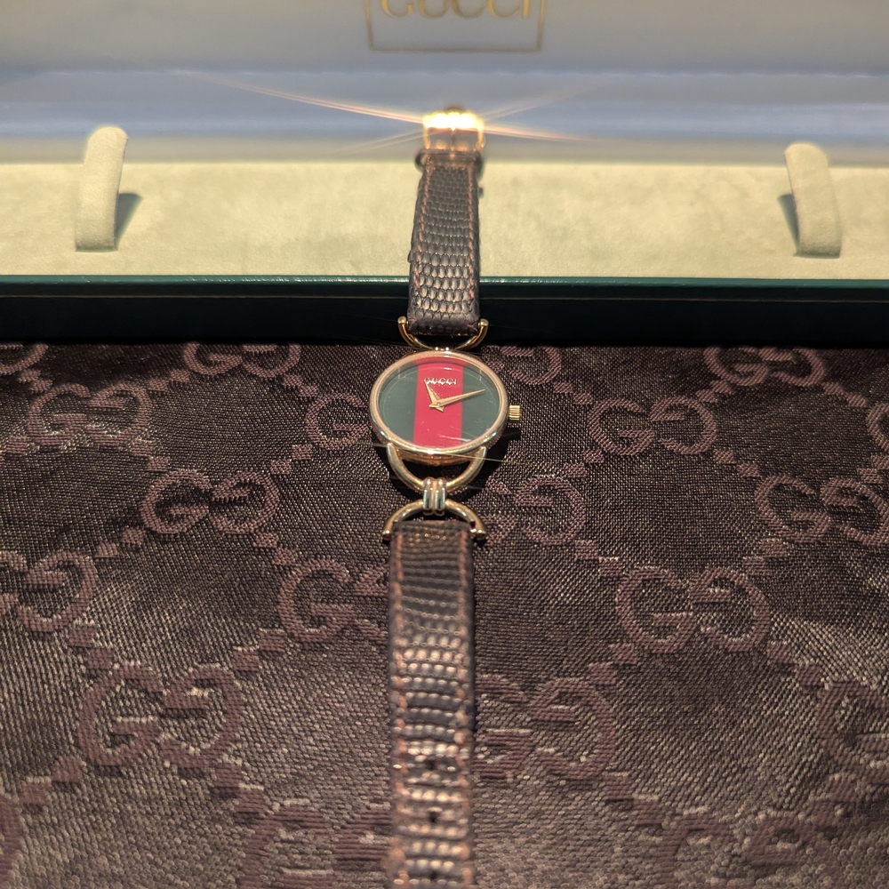 Gucci Women's Red and Gold Watch
